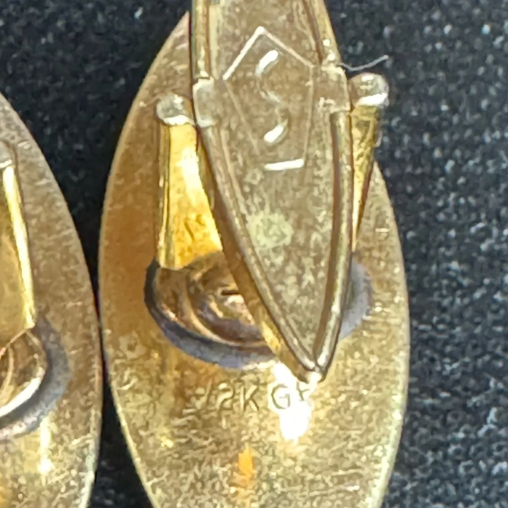 Vintage 1950s Swank men’s 12k GF Pat pending cufflinks w/ruby gem-like starburst